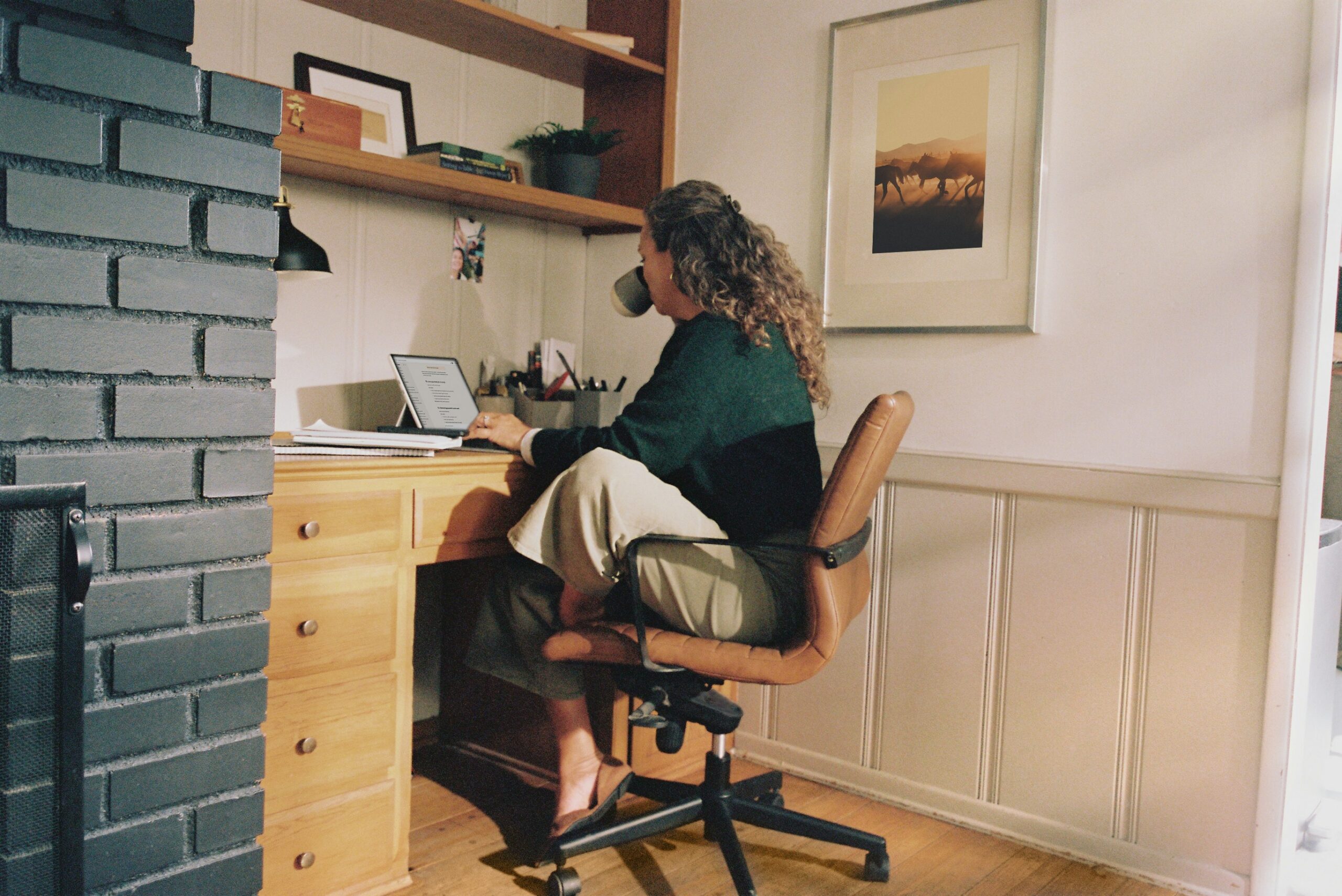 Woman at chair using laptop
