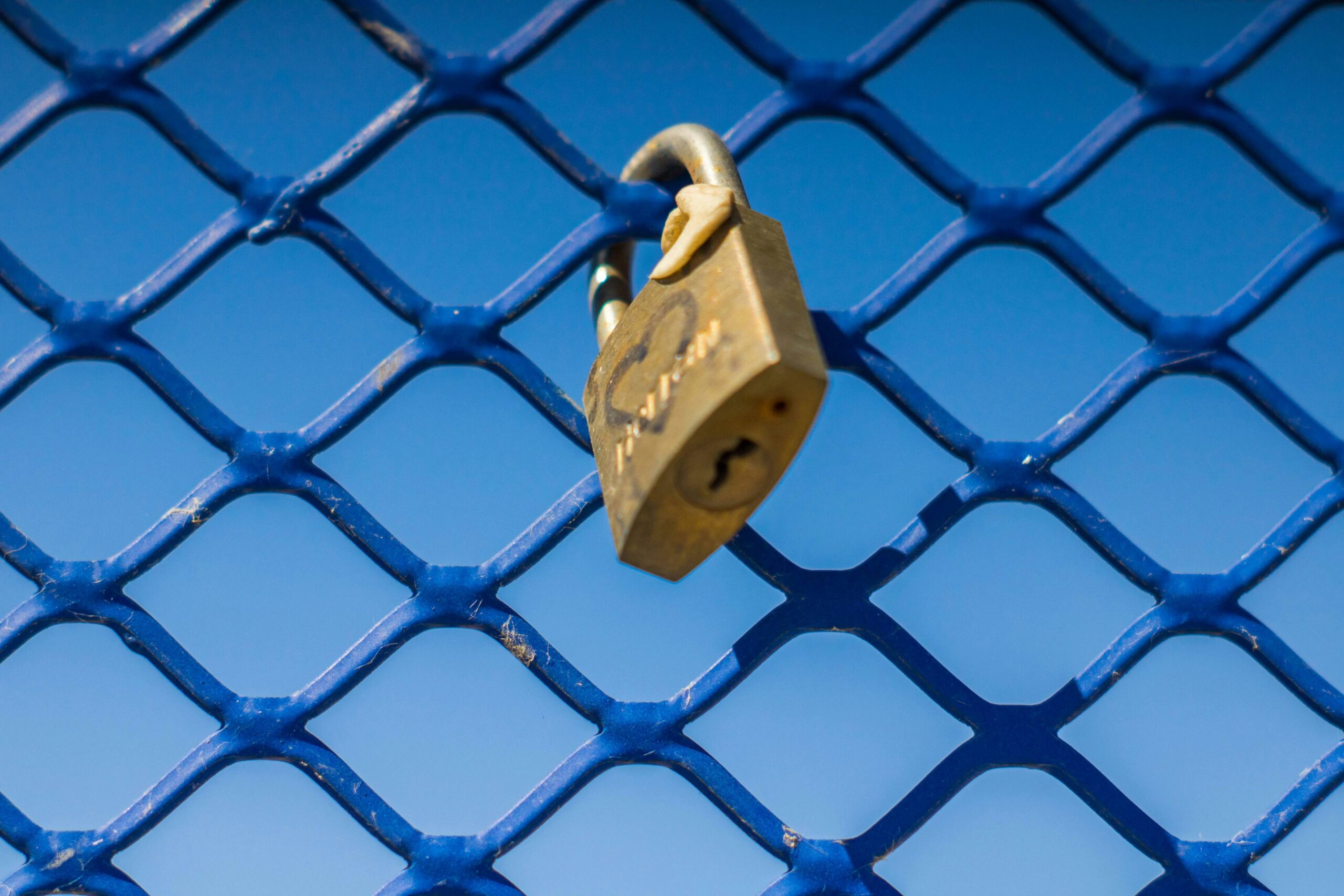 Padlock on fence