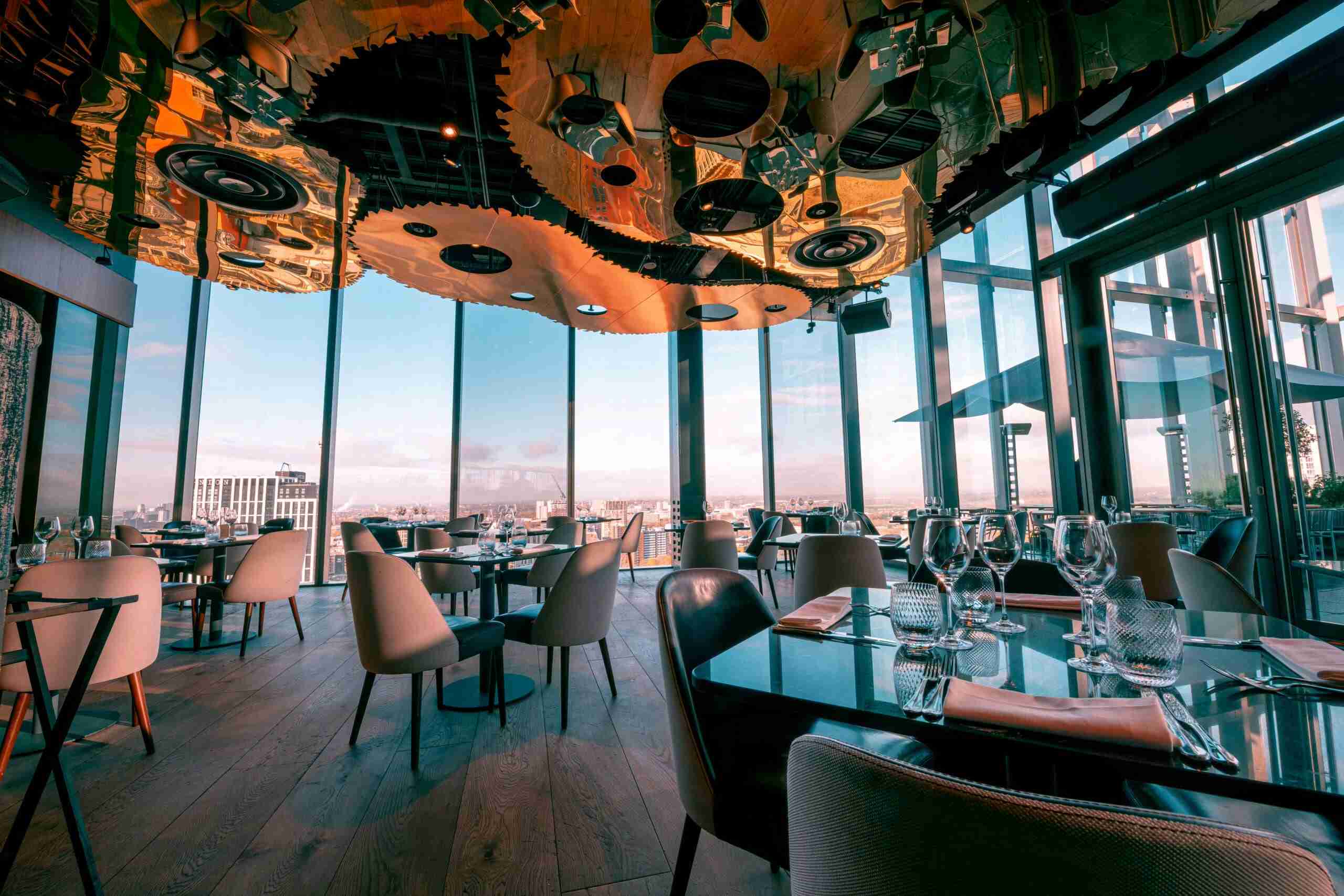 Restaurant with tables and chairs.