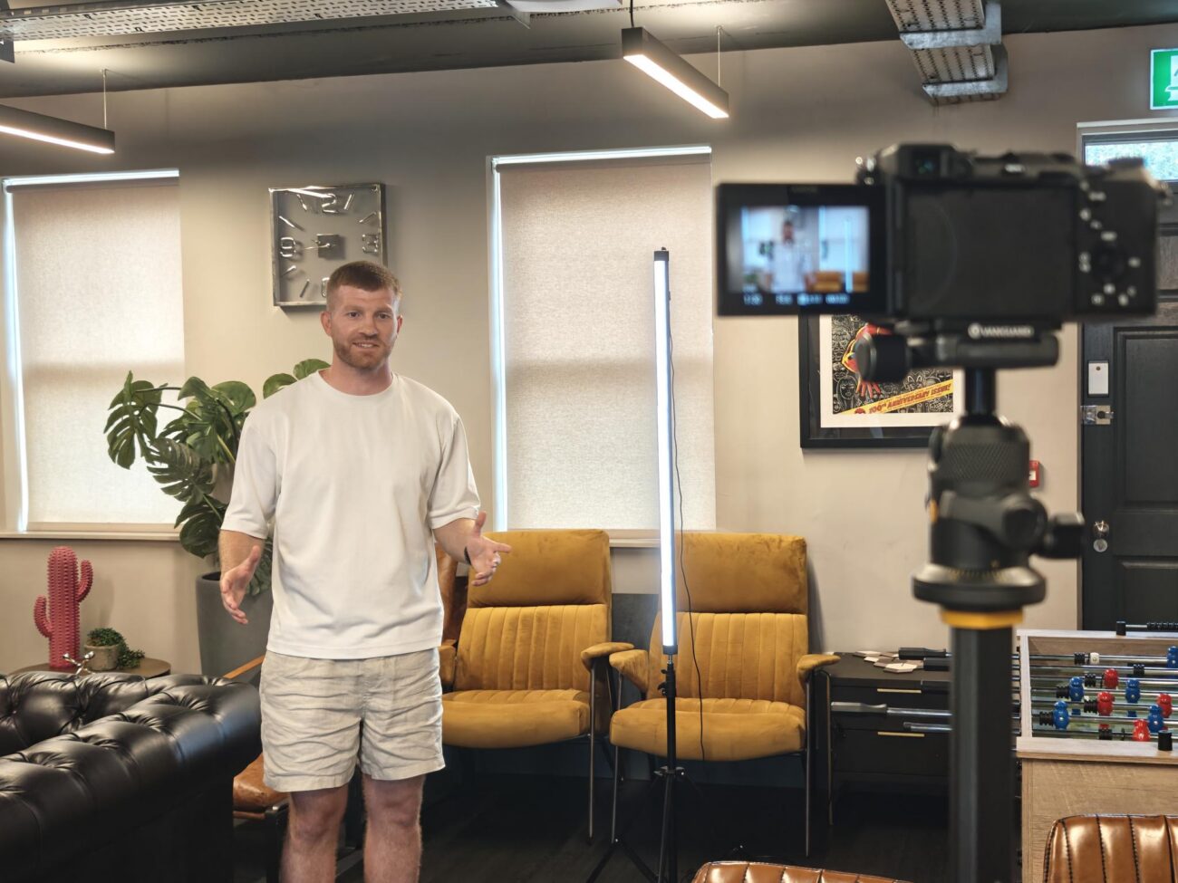 Man being filmed by a camera
